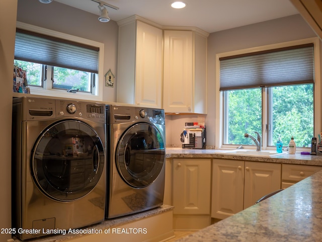 1561 Roseland Ave, East Lansing, MI 48823 - laundry room with washer and clothes dryer, cabinet space, and recessed lighting