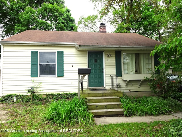 341 W Saginaw St, East Lansing, MI 48823 - bungalow-style home featuring a chimney