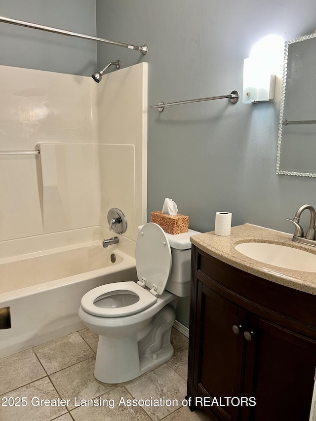 341 W Saginaw St, East Lansing, MI 48823 - full bath featuring tile patterned flooring, toilet, shower / washtub combination, and vanity