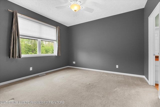 3816 Kiskadee Dr, East Lansing, MI 48823 - carpeted spare room featuring ceiling fan, a textured ceiling, and baseboards