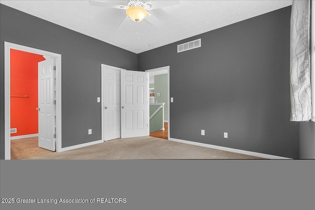 3816 Kiskadee Dr, East Lansing, MI 48823 - unfurnished bedroom featuring baseboards, carpet floors, a closet, and ceiling fan