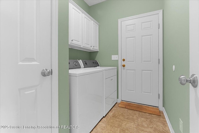 3816 Kiskadee Dr, East Lansing, MI 48823 - clothes washing area featuring washer and dryer, cabinet space, and baseboards