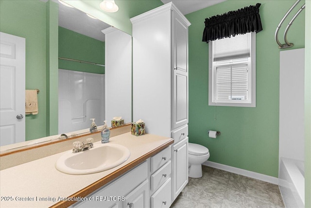3816 Kiskadee Dr, East Lansing, MI 48823 - bathroom featuring baseboards, toilet, vanity, and a shower