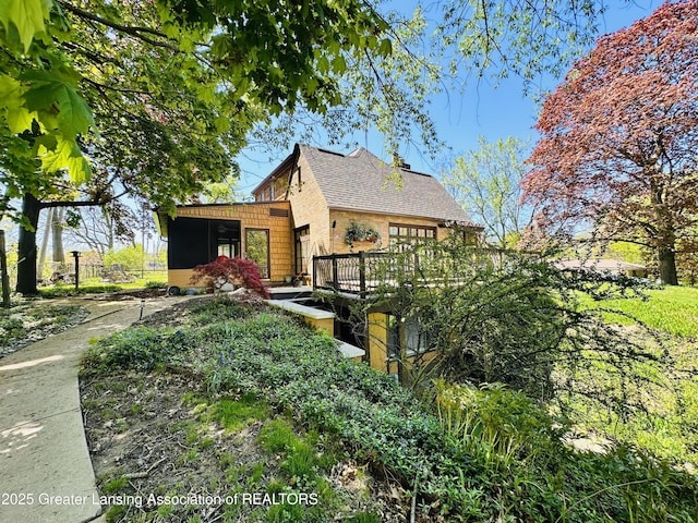 812 Dryer Farm Rd, Lansing, MI 48917 - view of property exterior featuring a sunroom