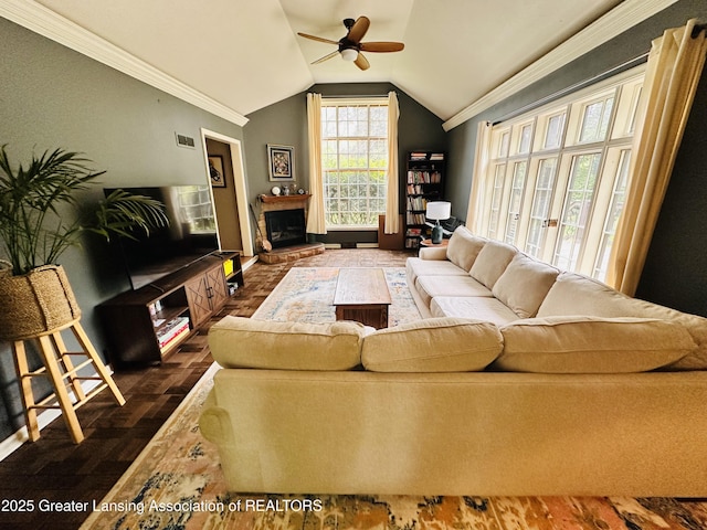 812 Dryer Farm Rd, Lansing, MI 48917 - living room with ornamental molding, ceiling fan, lofted ceiling, wood finished floors, and baseboards