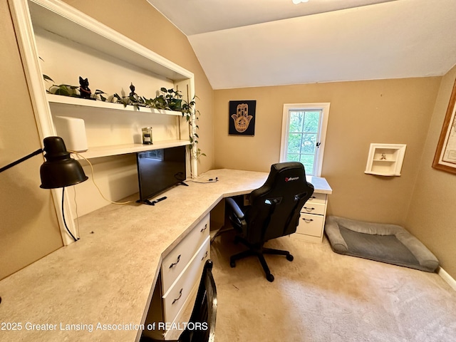 812 Dryer Farm Rd, Lansing, MI 48917 - office area featuring built in study area, light colored carpet, and vaulted ceiling