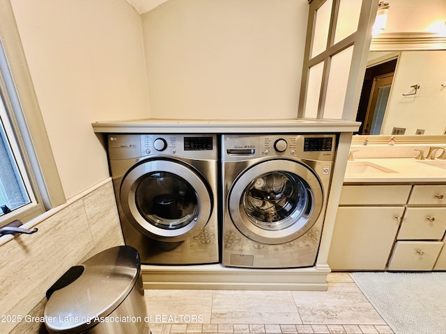 812 Dryer Farm Rd, Lansing, MI 48917 - laundry area featuring washing machine and clothes dryer and wainscoting
