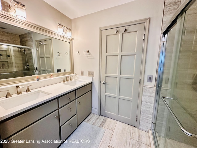 812 Dryer Farm Rd, Lansing, MI 48917 - full bathroom featuring a shower stall, double vanity, and wood finished floors