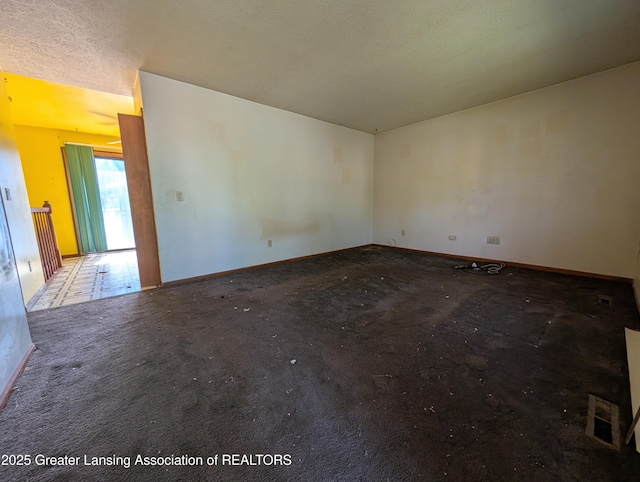 5650 Hughes Rd, Lansing, MI 48911 - unfurnished room featuring baseboards and carpet flooring