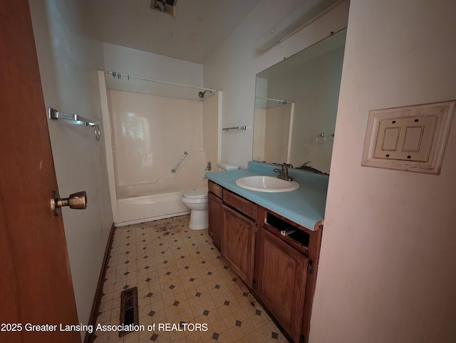 5650 Hughes Rd, Lansing, MI 48911 - full bath featuring toilet, vanity, tile patterned floors, shower / washtub combination, and baseboards