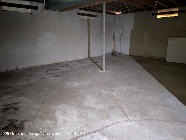 5650 Hughes Rd, Lansing, MI 48911 - unfinished below grade area featuring washer / dryer