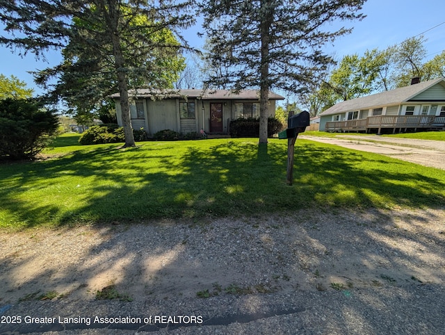 5650 Hughes Rd, Lansing, MI 48911 - view of front of home with a front yard