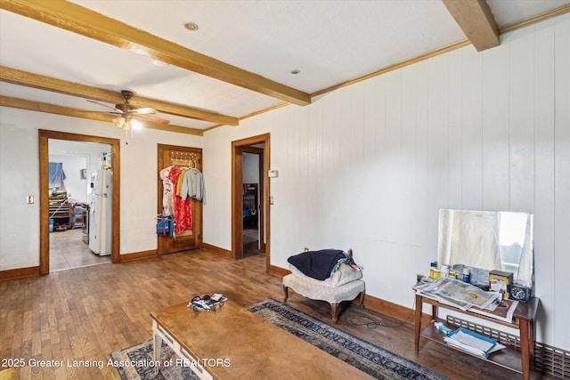 912 Pacific Ave, Lansing, MI 48910 - sitting room featuring beam ceiling, wood finished floors, baseboards, and ceiling fan