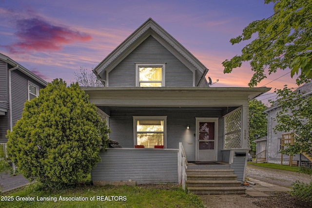 shotgun-style home featuring a porch