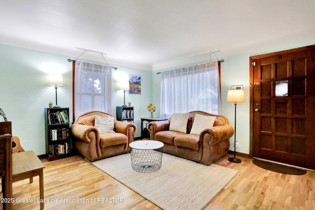 1411 Poxson Ave, Lansing, MI 48910 - living room with light wood-style floors and baseboards