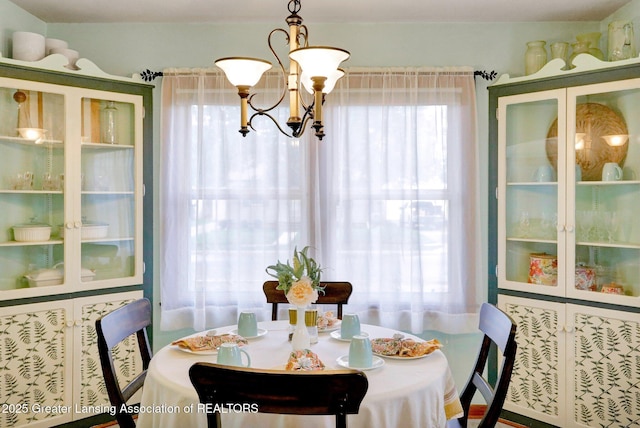 1411 Poxson Ave, Lansing, MI 48910 - dining area featuring a chandelier