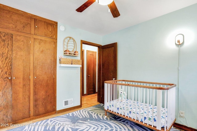 1411 Poxson Ave, Lansing, MI 48910 - bedroom with wood finished floors and ceiling fan