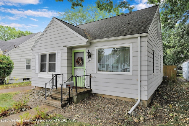 1411 Poxson Ave, Lansing, MI 48910 - view of front of home featuring roof with shingles
