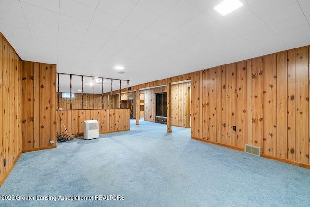 15988 Comdon Rd, Albion, MI 49224 - finished below grade area featuring carpet flooring, wood walls, and baseboards