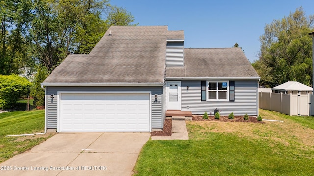 4918 Westhaven Blvd, Lansing, MI 48917 - view of front of house featuring concrete driveway, a garage, and roof with shingles