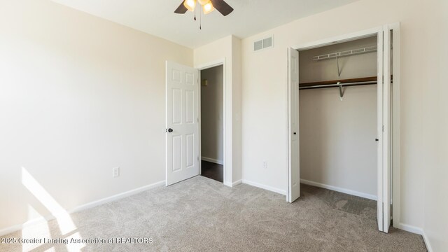 4918 Westhaven Blvd, Lansing, MI 48917 - unfurnished bedroom featuring carpet, a closet, baseboards, and ceiling fan