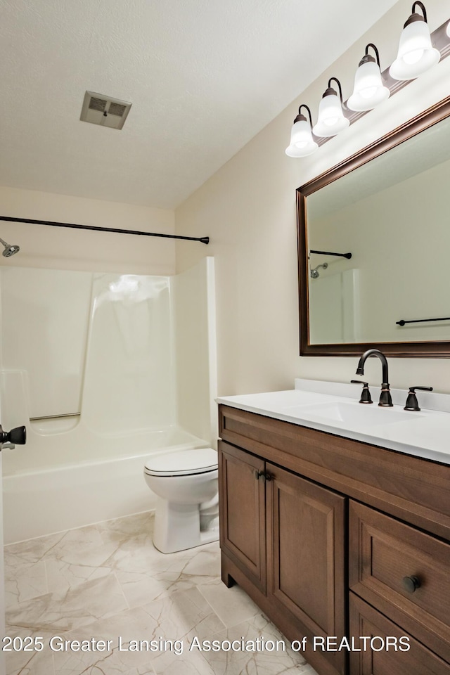 4918 Westhaven Blvd, Lansing, MI 48917 - bathroom featuring toilet, vanity, and bathtub / shower combination
