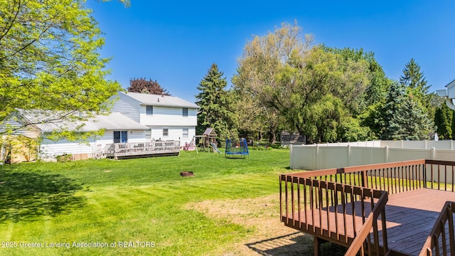 4918 Westhaven Blvd, Lansing, MI 48917 - view of yard featuring a wooden deck and a playground