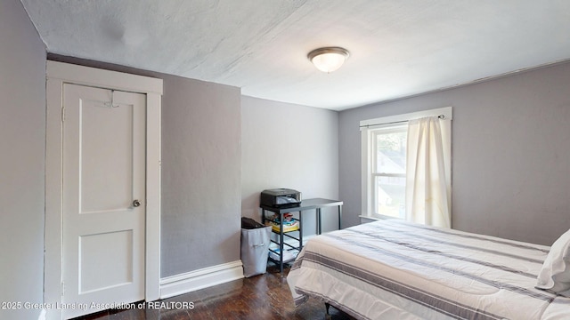 1023 Bement St, Lansing, MI 48912 - bedroom featuring wood finished floors and baseboards