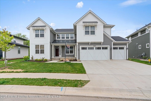5651 Copper Creek Dr, Haslett, MI 48840 - view of front facade with board and batten siding, driveway, a front lawn, and a garage