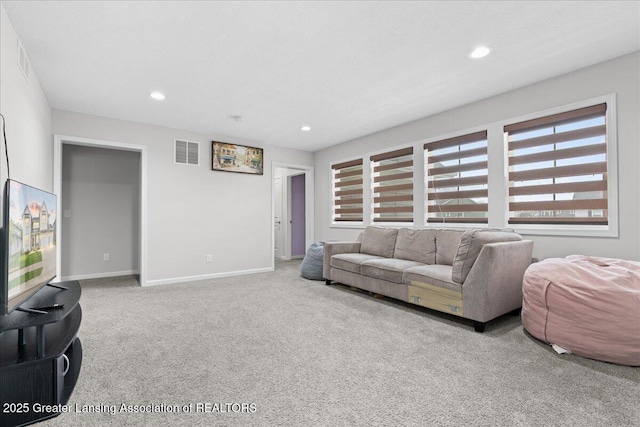 5651 Copper Creek Dr, Haslett, MI 48840 - living room featuring carpet, baseboards, and recessed lighting