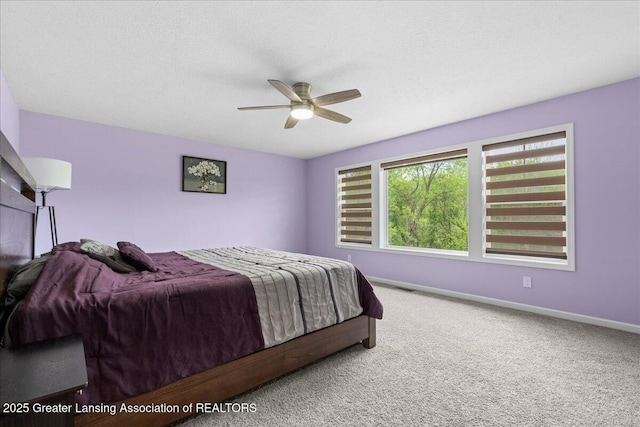 5651 Copper Creek Dr, Haslett, MI 48840 - bedroom with carpet, baseboards, and a ceiling fan