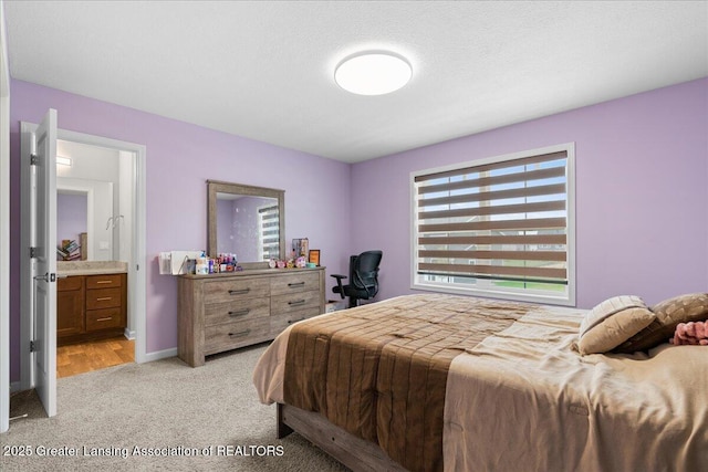5651 Copper Creek Dr, Haslett, MI 48840 - bedroom with light colored carpet and baseboards