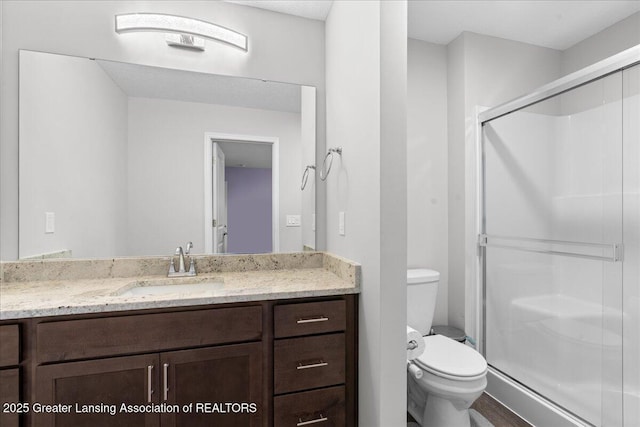 5651 Copper Creek Dr, Haslett, MI 48840 - bathroom with toilet, a stall shower, and vanity