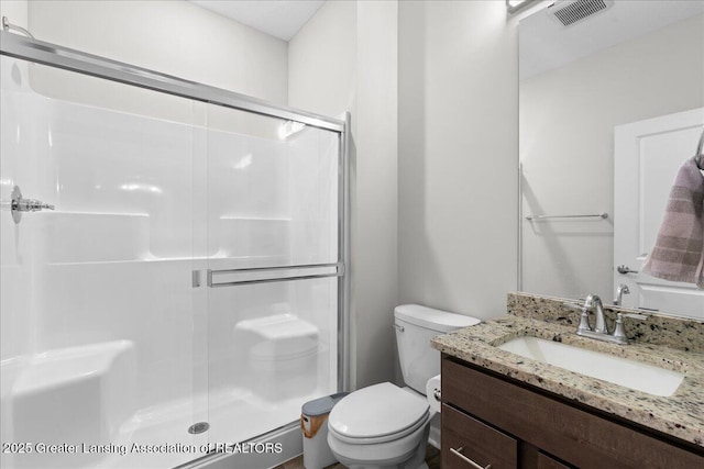5651 Copper Creek Dr, Haslett, MI 48840 - full bath featuring a shower stall, toilet, and vanity