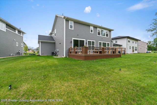 5651 Copper Creek Dr, Haslett, MI 48840 - back of property with a wooden deck and a yard