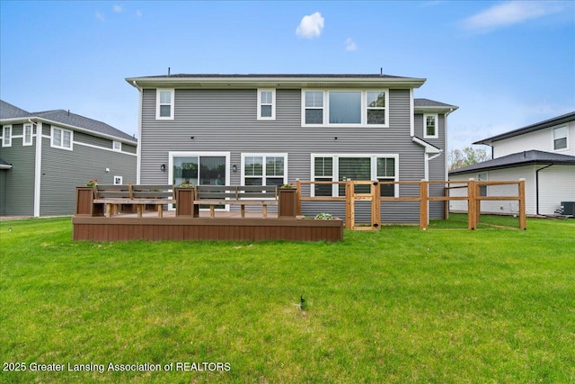 5651 Copper Creek Dr, Haslett, MI 48840 - rear view of house with a deck and central AC unit