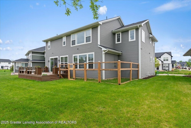 5651 Copper Creek Dr, Haslett, MI 48840 - rear view of house featuring a wooden deck and a lawn