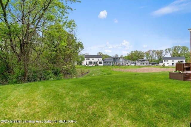 5651 Copper Creek Dr, Haslett, MI 48840 - view of green lawn featuring a residential view