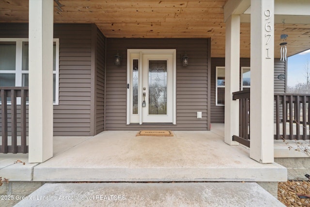 9671 Lakeside Dr, Perrinton, MI 48871 - view of exterior entry featuring covered porch