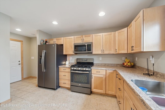 9671 Lakeside Dr, Perrinton, MI 48871 - kitchen with appliances with stainless steel finishes, light brown cabinets, recessed lighting, a sink, and baseboards