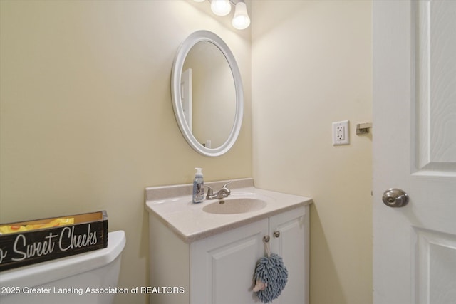 9671 Lakeside Dr, Perrinton, MI 48871 - bathroom with vanity and toilet