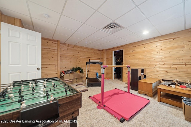 9671 Lakeside Dr, Perrinton, MI 48871 - game room with wood walls, a paneled ceiling, and carpet floors