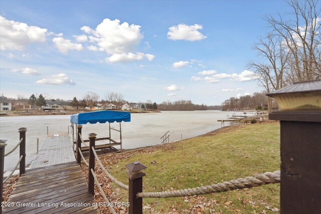 9671 Lakeside Dr, Perrinton, MI 48871 - view of green lawn featuring a water view and a boat dock