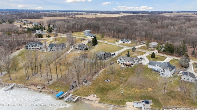 9671 Lakeside Dr, Perrinton, MI 48871 - aerial overview of property's location with a heavily wooded area