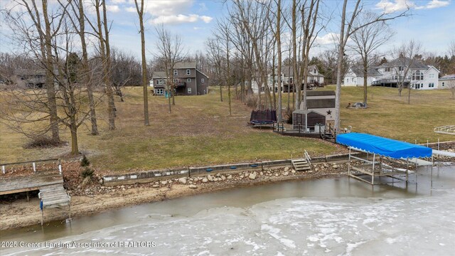 9671 Lakeside Dr, Perrinton, MI 48871 - dock area with a yard and a water view