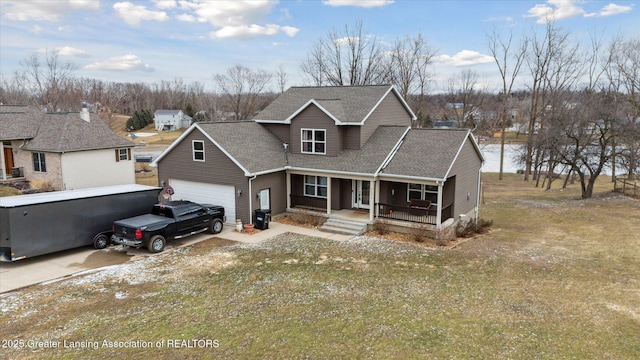 9671 Lakeside Dr, Perrinton, MI 48871 - traditional home with a porch, a shingled roof, a garage, and driveway