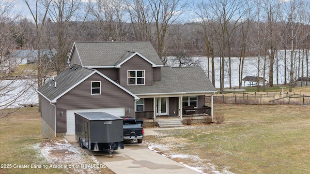 9671 Lakeside Dr, Perrinton, MI 48871 - view of front of home with covered porch, concrete driveway, and a shingled roof