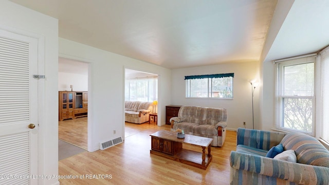 5120 Wardcliff Dr, East Lansing, MI 48823 - living room with light wood-style floors and baseboards
