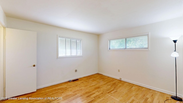 5120 Wardcliff Dr, East Lansing, MI 48823 - spare room with light wood-style flooring and baseboards