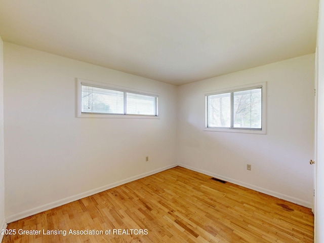 5120 Wardcliff Dr, East Lansing, MI 48823 - spare room featuring light wood-style floors and baseboards